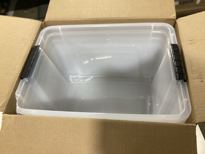 Condition photo showing As Is for IRIS USA 32 Qt Stackable Plastic Storage Bins with Lids, 4 Pack - BPA-Free, Made in USA - See-Through Organizing Solution, Latches, Durable Nestable Containers, Secure Pull Handle - Clear Clear 32 Qt 4 Pack