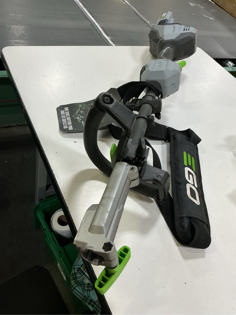 Condition photo showing As Is for ego power+ combo, cordless trimmer and blower, 15" trimmer for weeds and grass with powerload and cordless electric 670 cfm blower, includes 56v 4.0ah battery and charger - st6703lb w/leaf blower + 4.0ah battery