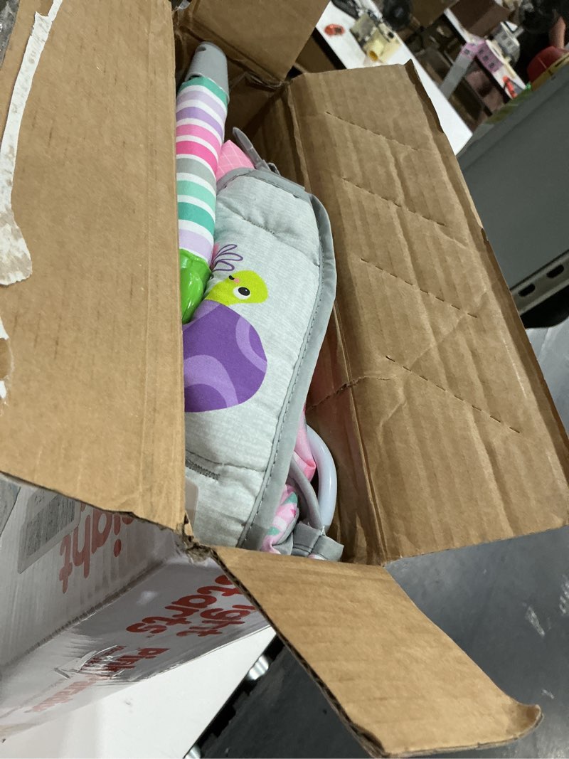 Condition photo showing As Is for bright starts pink paradise portable baby bouncer with vibrating infant seat and -toy bar, max weight 20 lbs., age 0-6 months