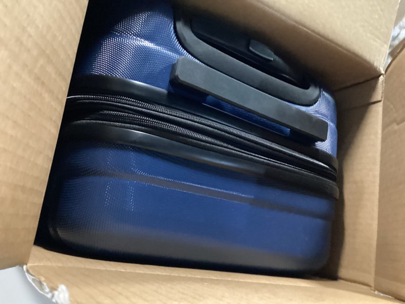 Condition photo showing Good Condition for amazon basics 21" hardside carry-on luggage with multi-directional wheels, expandable for up to 25% more space, scratch-resistant surface, organized interior, navy blue navy blue carry-on