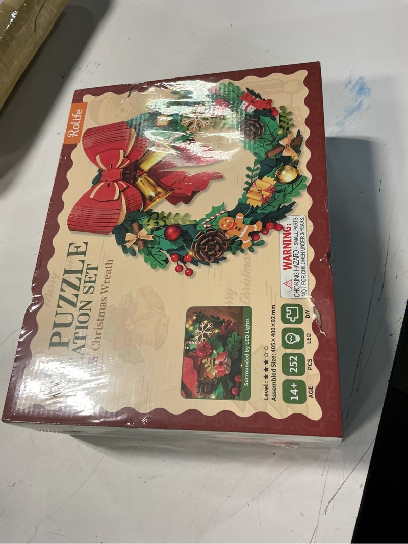 Condition photo showing New/Like New for rolife 3d puzzles for adults christmas wreaths for front door, artificial eucalyptus wreath for all seasons, indoor and outdoor wreath with red bow&golden bell, led for christmas decor (16in, 252pcs)