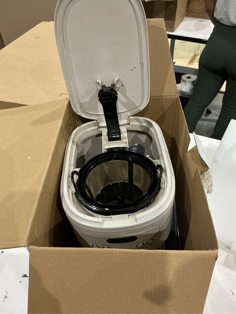 Condition photo showing As Is for bella 12 cup programmable coffee marker, reusable dishwasher safe accessories, easy lcd diaply, auto shutoff, 900 watt, oatmilk