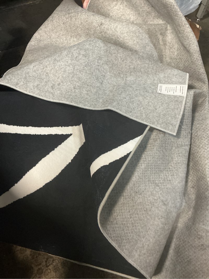 Condition photo showing Good Condition for YIHOUSE Washable Area Rug 6'x9'-Abstract Black and White Rug for Living Room Bedroom, Large Modern Non-Slip Ultra-Thin Rug Home Decor,Black Curve,6x9ft Black Curve 6'x9'ft