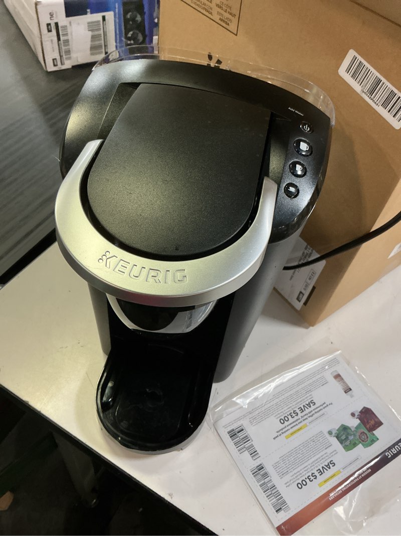 Condition photo showing As Is for keurig k-compact single-serve k-cup pod coffee maker, with 3 brew sizes, smart start feature, 36oz removable reservoir, black
