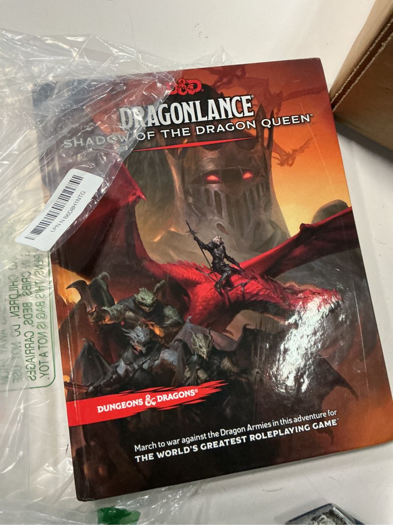 Condition photo showing New/Like New for dungeons & dragons dragonlance: shadow of the dragon queen adventure book physical book