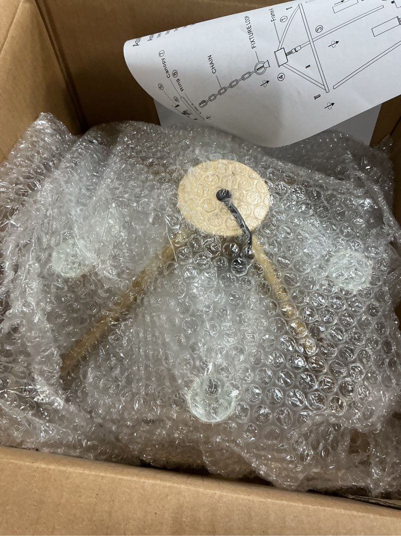 Condition photo showing As Is for MELUCEE 4-Light Gold Farmhouse Chandelier Iron Lantern Pendant Light Rustic Cage Hanging Light Fixtures Industrial Foyer Lights for Kitchen Island Dining Room Hallway Foyer Entryway, E12 Base Gold 4-Light