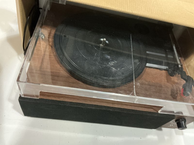 Condition photo showing As Is for core innovations wireless bluetooth turntable, 3-speed vinyl record player with built-in speakers, wood finish & clear dust cover