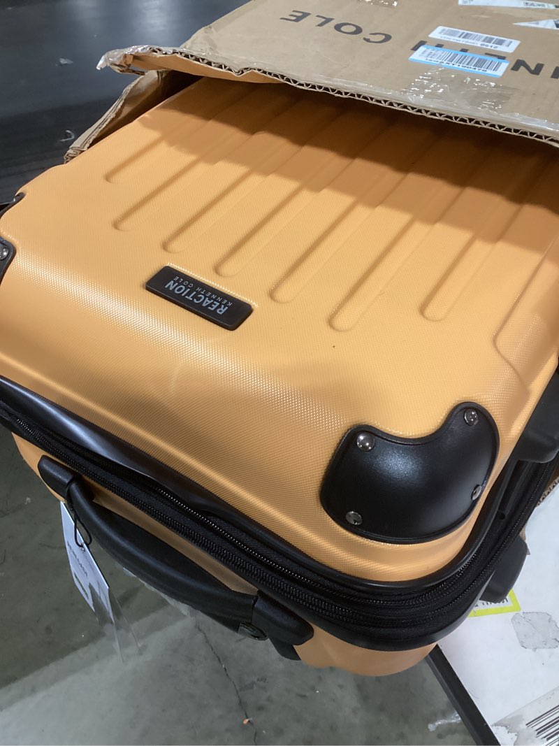Condition photo showing Good Condition for Kenneth Cole REACTION Renegade Luggage Expandable 8-Wheel Spinner Lightweight Hardside Suitcase, Dreamsicle, 20-Inch Carry On Dreamsicle 20-Inch Carry On