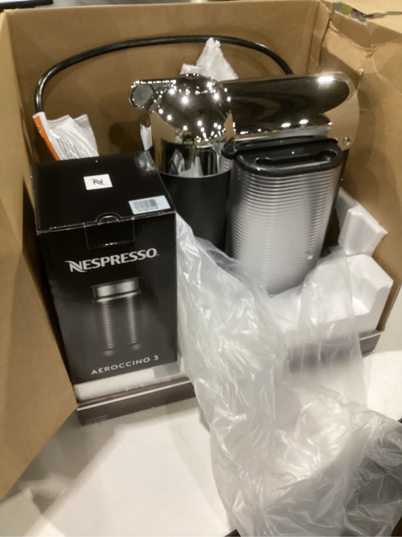 Condition photo showing As Is for nespresso vertuo coffee and espresso maker by breville, chrome with aeroccino milk frother machine + milk frother chrome, not tested
