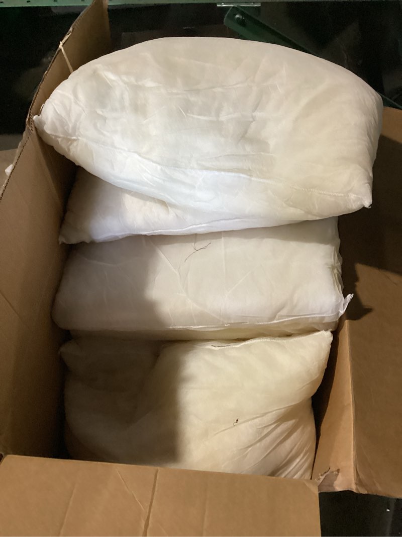 Condition photo showing As Is for 7 or 8 cheap foam pillows with grey sip on pillow cases