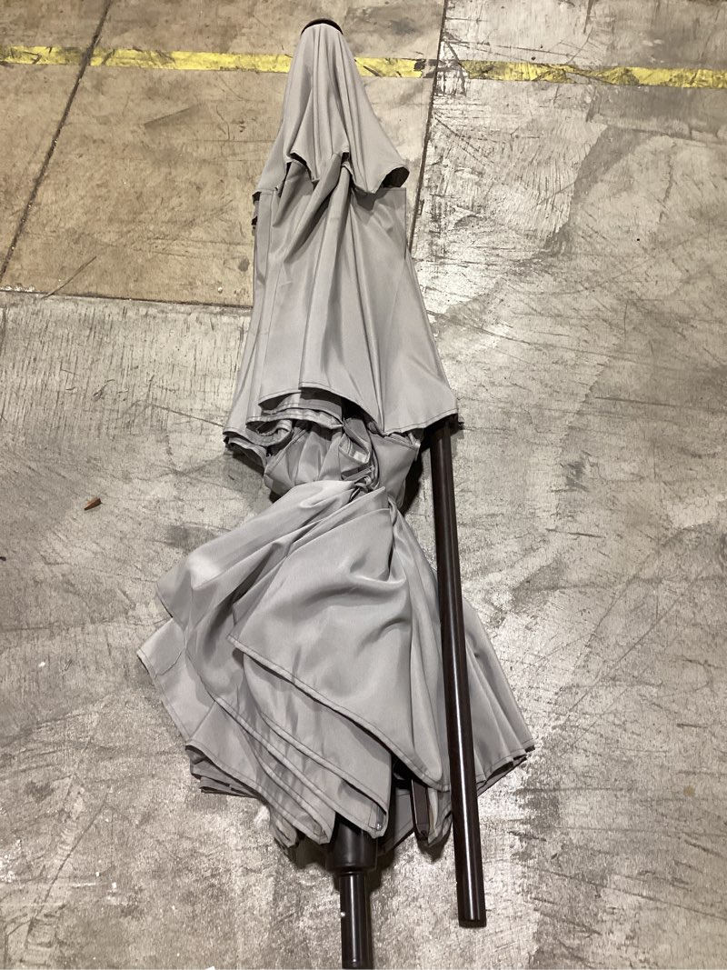 Condition photo showing As Is for patio premier 9-ft steel gray push-button tilt market patio umbrella