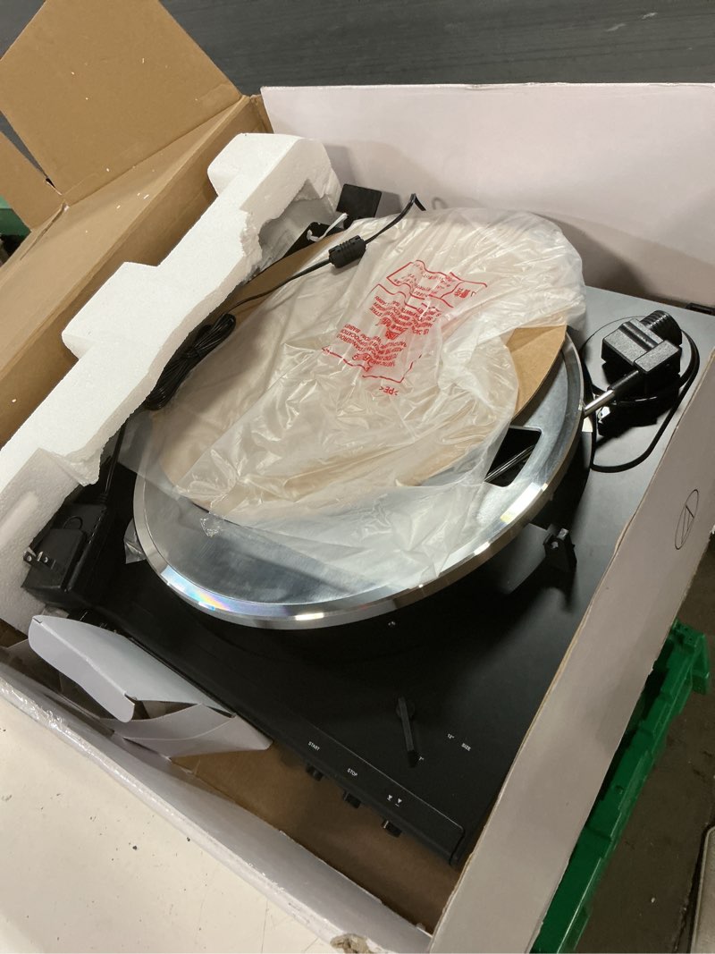 Condition photo showing As Is for audio-technica at-lp60x-bk fully automatic belt-drive stereo turntable, black, hi-fi, 2 speed, dust cover, anti-resonance, die-cast aluminum platter black wired turntable