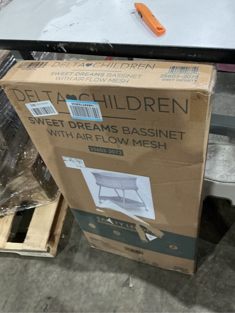 Condition photo showing New/Like New for delta children sweet dreams bassinet with airflow mesh bedside portable crib with vibration lights and music, grey infinity