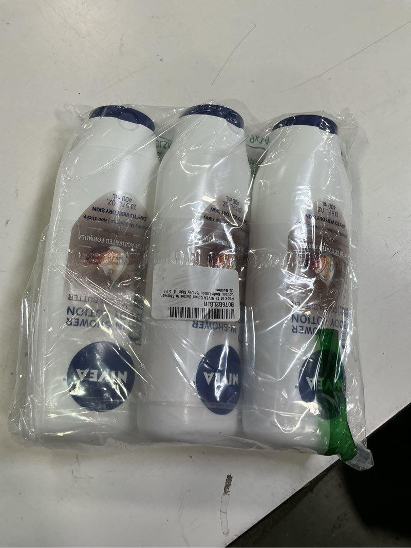 Condition photo showing New/Like New for NIVEA Cocoa Butter In Shower Lotion, Body Lotion for Dry Skin, 3 Pack of 13.5 Fl Oz Bottles