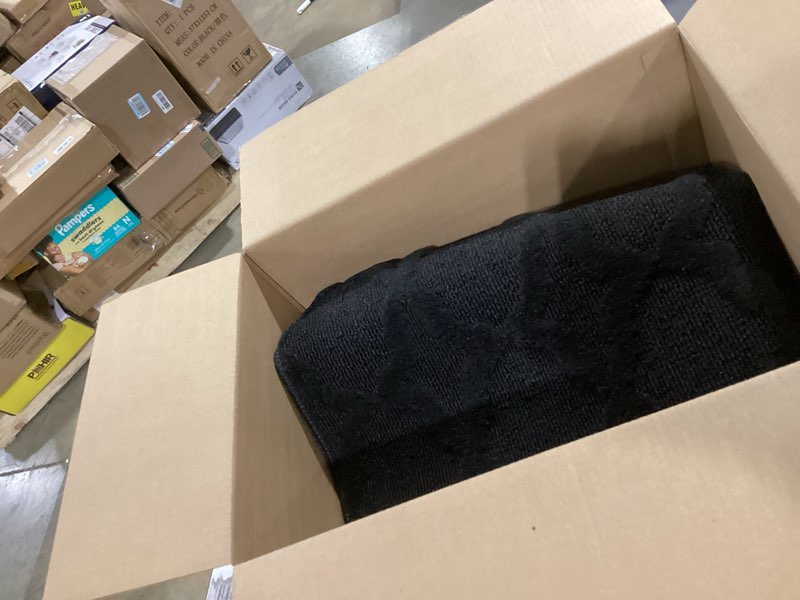 Condition photo showing Good Condition for garland rug sparta non slip polypropylene 3 ft. x 5 ft. black area rug- ideal for living rooms & hallways, stylish & durable for high traffic areas black 3' x 5' (rectangular)