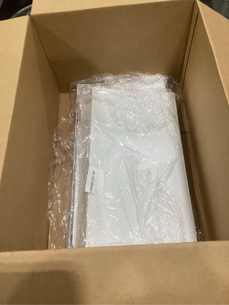 This item appears to be a white MDF radiator cover or similar flat-packed home furniture component.  