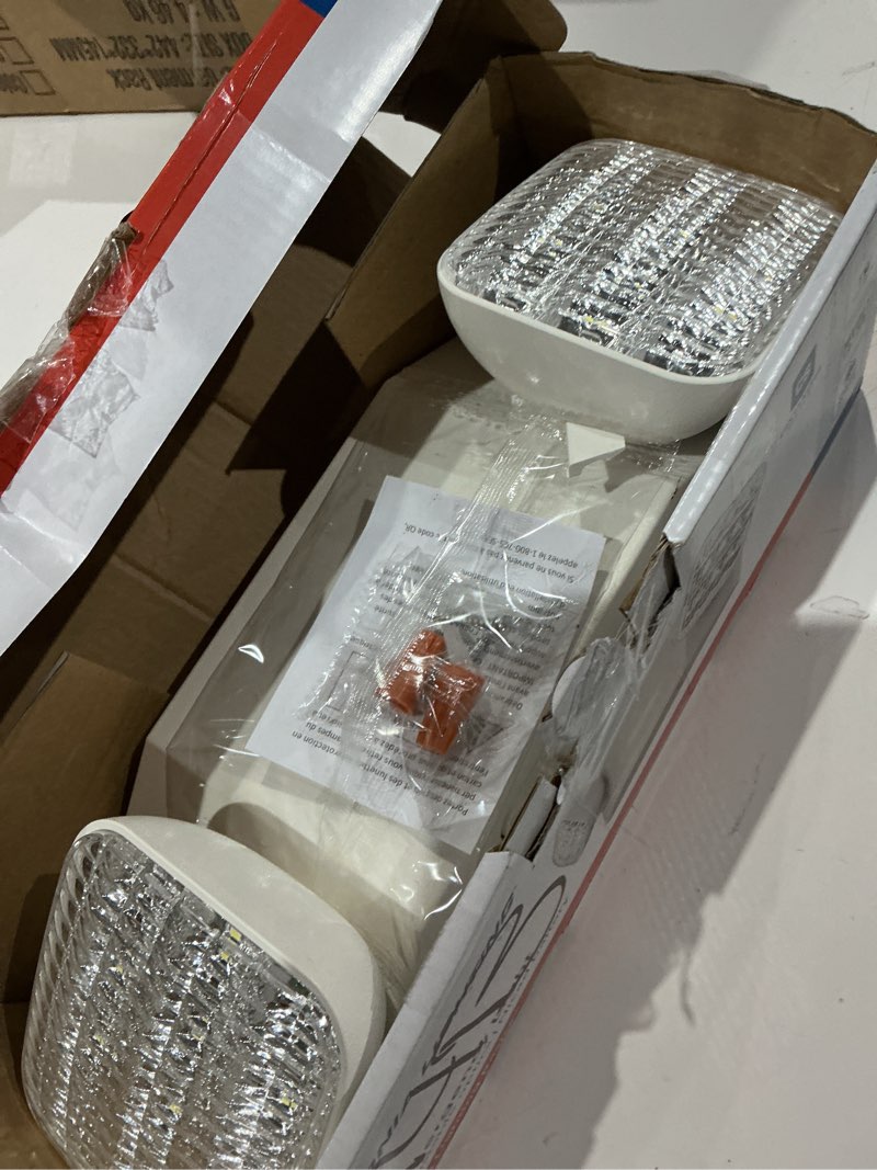 Condition photo showing As Is for lithonia lighting basics led emergency light, emergency lighting with dual adjustable led lamp heads, wall mount, damp location rated, 90-minute backup, 120/277v, white (eu2c m6)