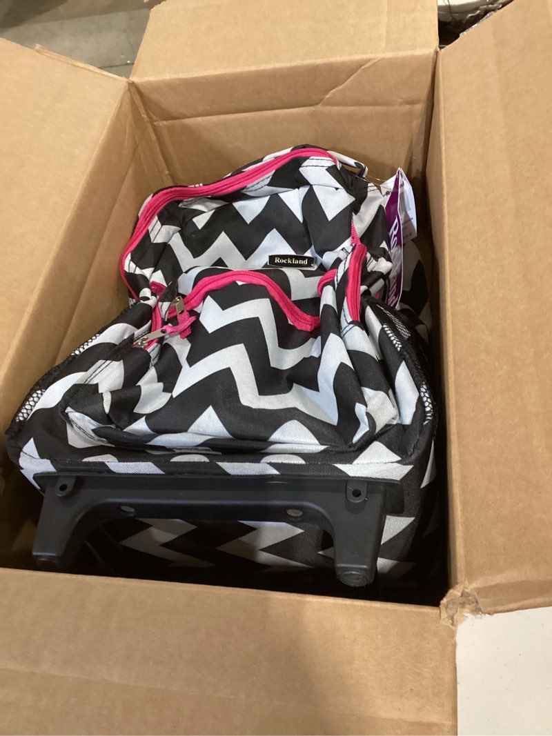 Condition photo showing As Is for rockland double handle 17" rolling backpack, pink chevron one size pink chevron