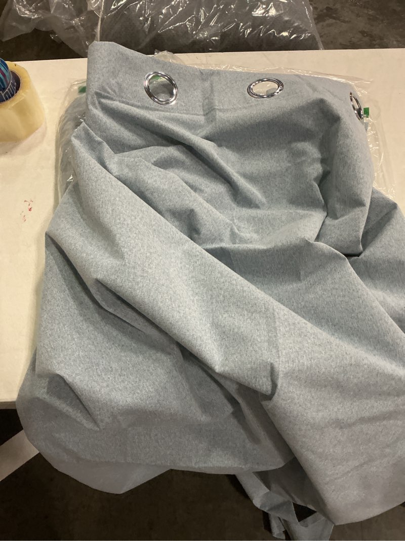 Condition photo showing Good Condition for light gray curtain panel featuring metal grommets for hanging (unknown size)
