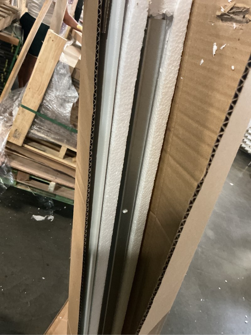 Condition photo showing As Is for incomplete hardware only… deluxe 44-48 in. w x 70 in. h framed sliding shower door in silver with 1/8 in. thick rain tempered glass