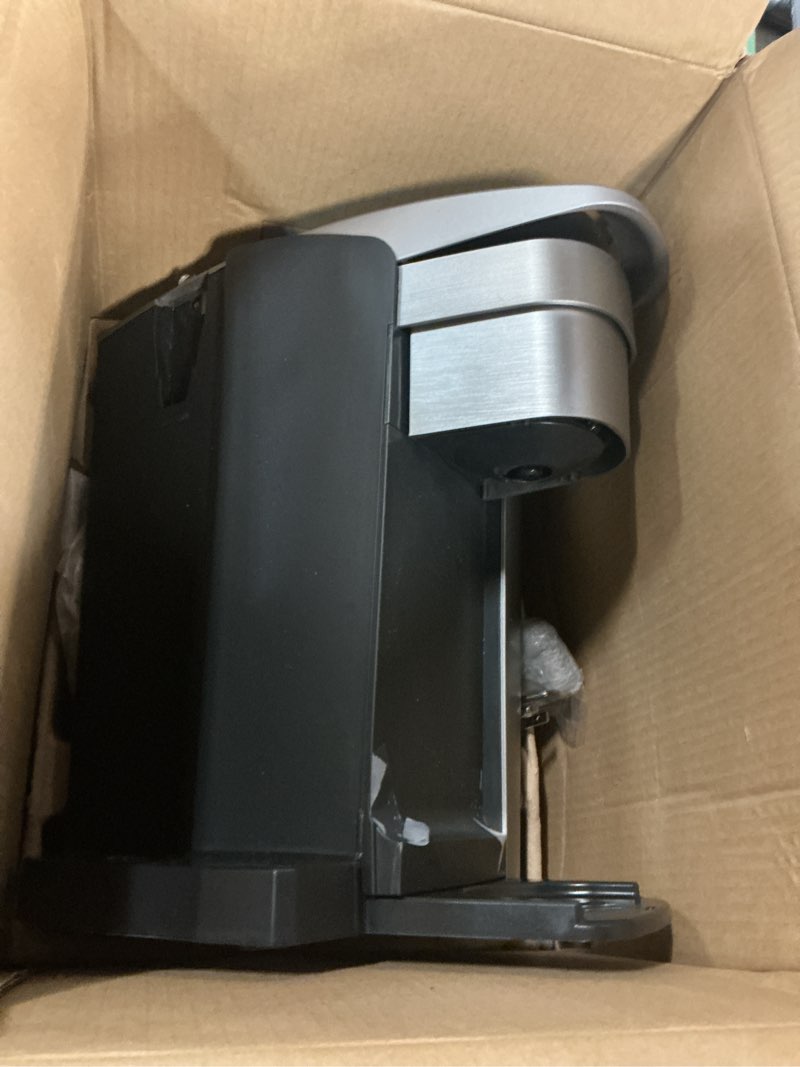 Condition photo showing As Is for keurig k-elite single serve k-cup pod coffee maker, with strength and temperature control, iced coffee capability, 8 to 12oz brew size, programmable, brushed silver