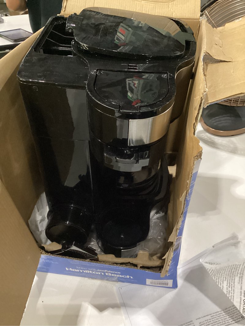 Condition photo showing As Is for hamilton beach 2-way programmable coffee maker, 12 cup glass carafe and single serve coffee maker, black with stainless steel accents, 49980rg 12 cup black, not tested, incomplete