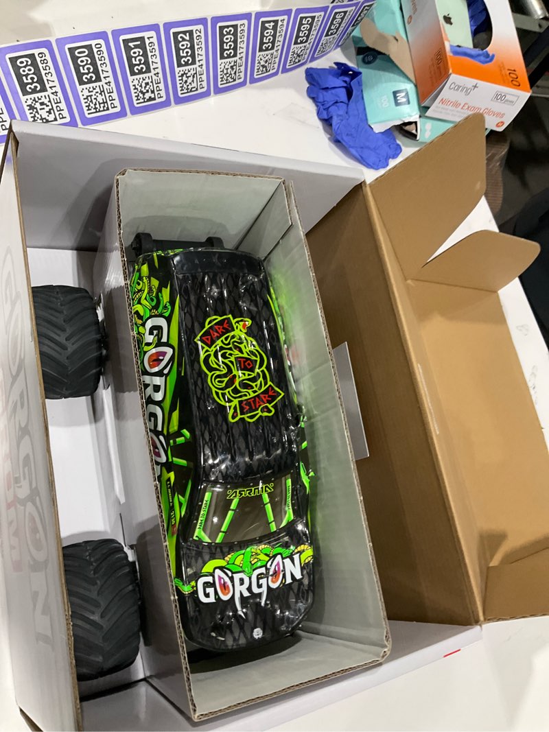 Condition photo showing As Is for arrma rc truck 1/16 gorgon grom 4x4 rtr brushed monster truck (battery & charger included), yellow, ara2130t1