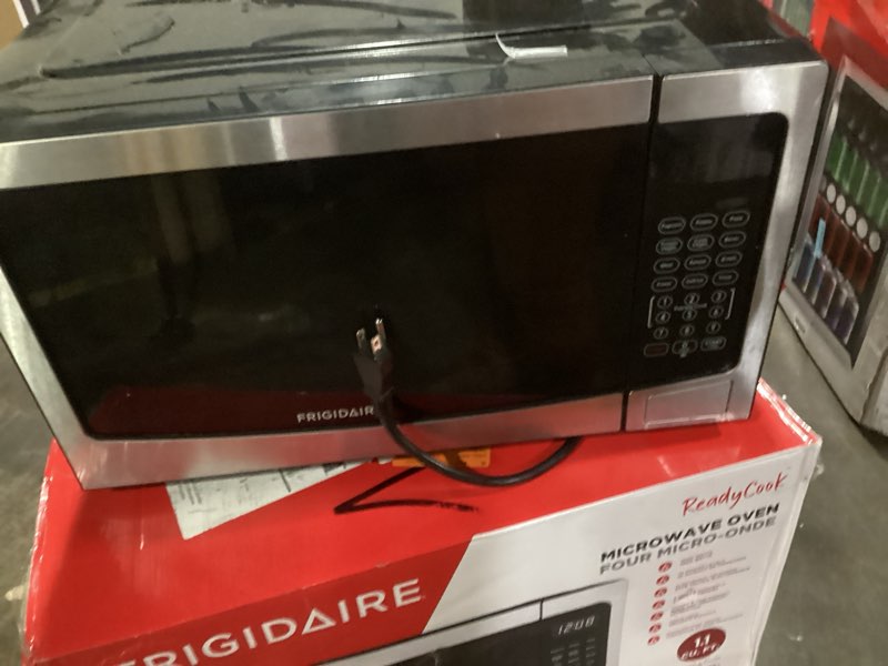 Condition photo showing Good Condition for Frigidaire EMW112OAMZ Stainless Steel Microwave Oven, Multi Function, Programmable, 1.1 Cu Ft 1000-Watt, residential kitchen, Stainless
