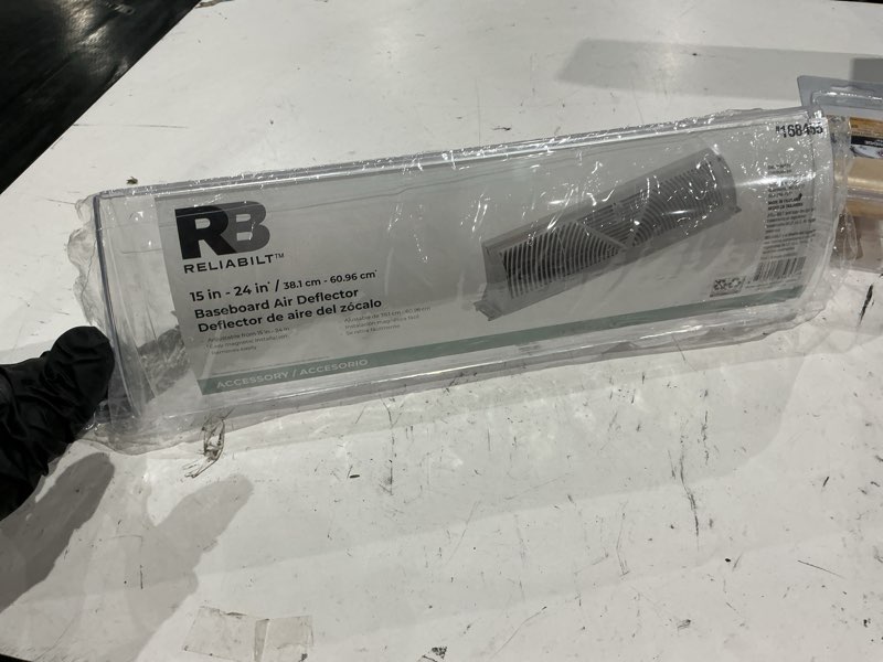 Condition photo showing As Is for reliabilt 16.38-in x 4.38-in adjustable magnetic mount plastic baseboard air deflector