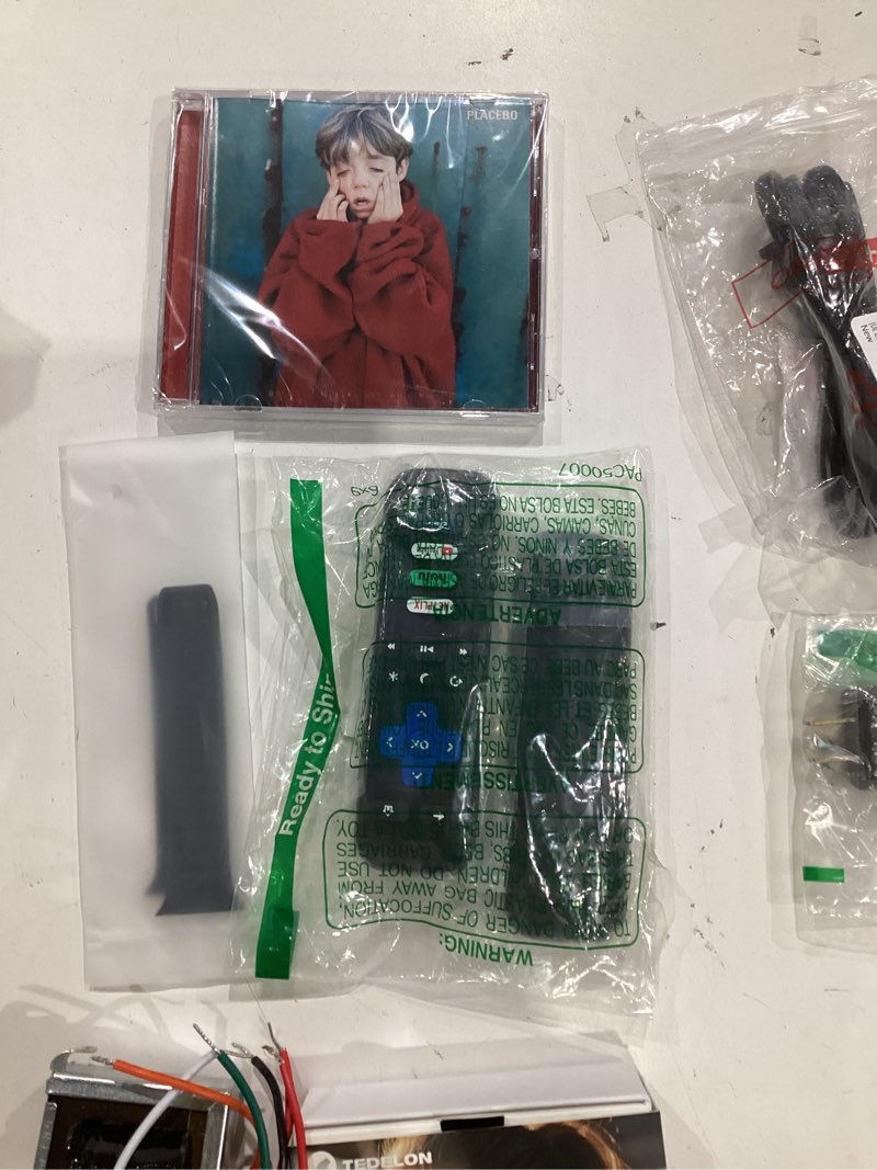 Condition photo showing As Is for assorted lot of electronics (headphones, small gadgets, headsets, etc.) 