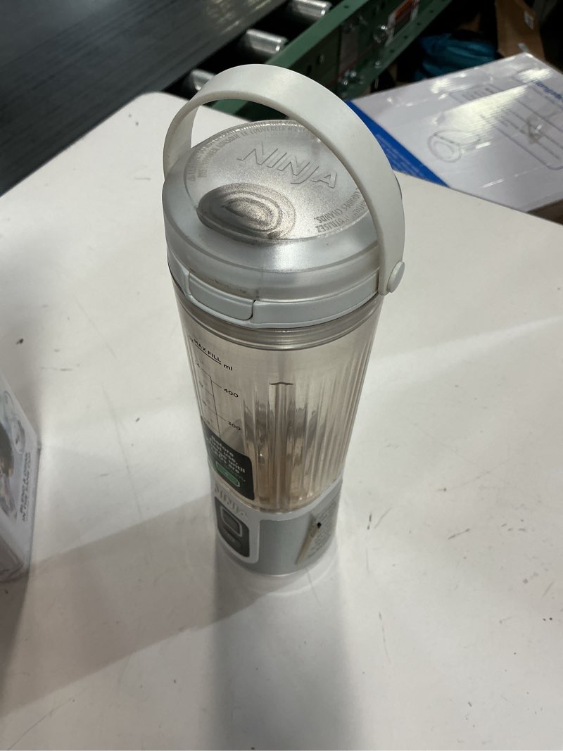 Condition photo showing As Is for ninja bc151wh blast portable blender, cordless, 18oz. vessel, personal blender-for shakes & smoothies, bpa free, leakproof-lid & sip spout, usb-c rechargeable, dishwasher safe parts, white