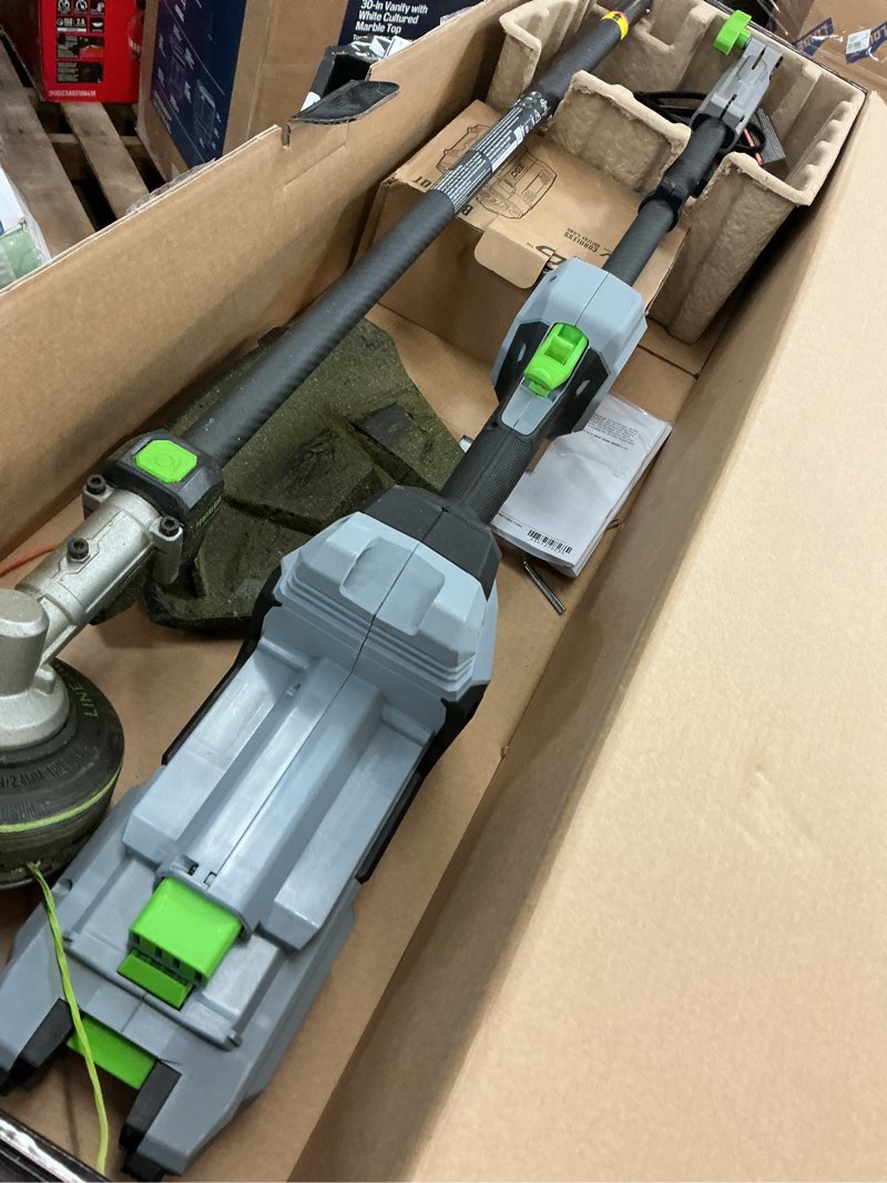 Condition photo showing As Is for ego power+ multi-head system with line iq, powerload 56-volt 17-in straight shaft attachment capable battery string trimmer 5 ah (battery included) (charger included)