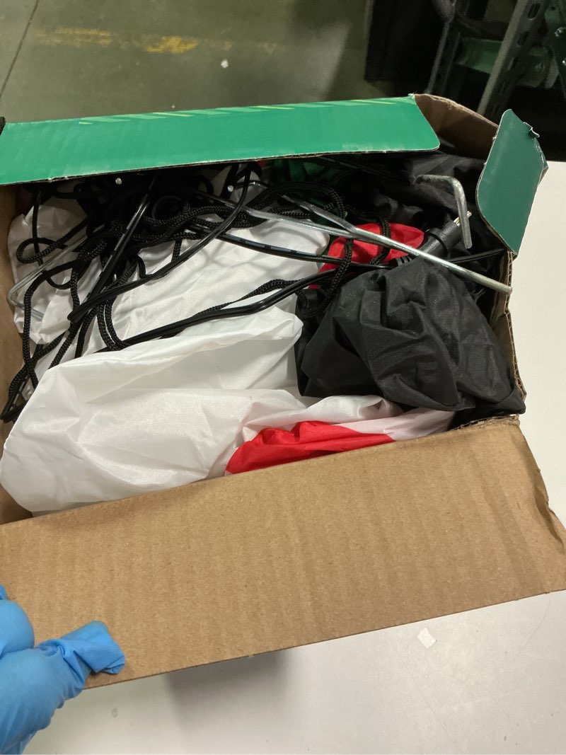 Condition photo showing As Is for Holiday living  7 ft lighted snowman with candy cane