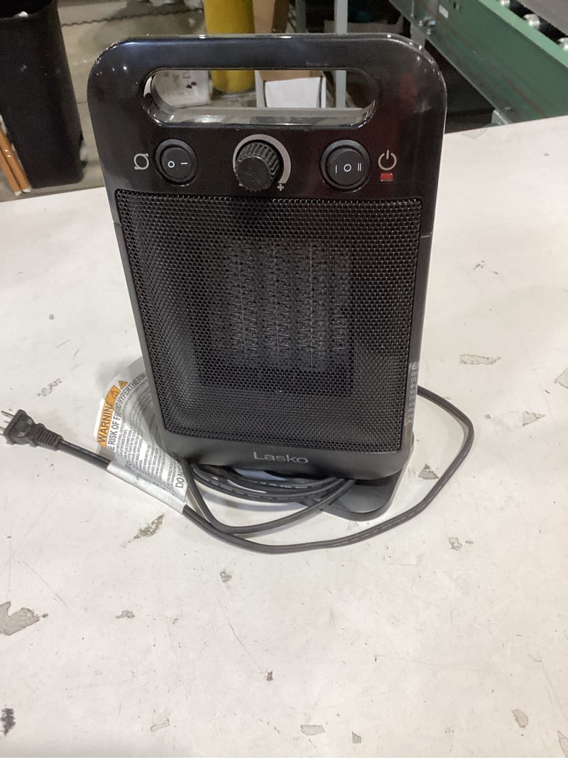 Condition photo showing As Is for lasko myheat go 1500-watt 12 in. black electric tabletop ceramic space heater with overheat protection & adjustable thermostat