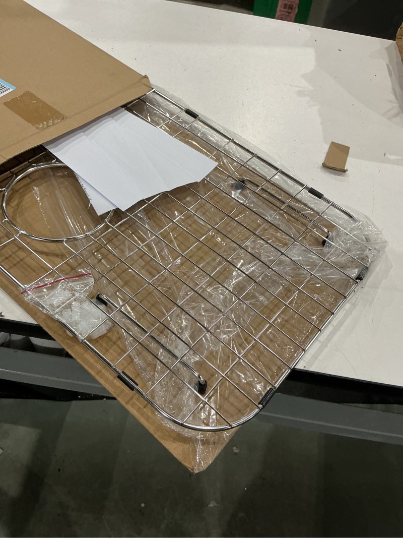 Condition photo showing Good Condition for sink protector grid 24-1/8" x 12-5/8", centered drain with corner radius 1-1/2", sink protector stainless steel material for single bowl 24-1/8" x 12-5/8" centered drain