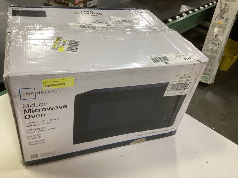 Condition photo showing New/Like New for mainstays 1.1 cu ft microwave oven in black