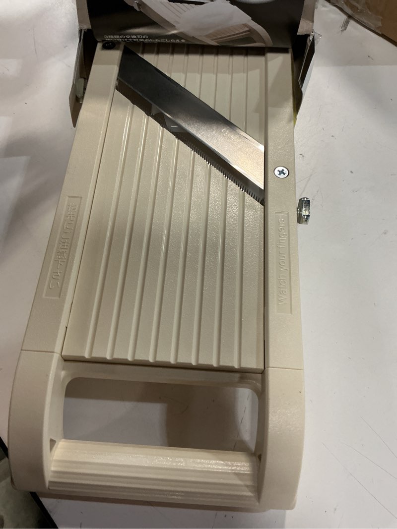 Condition photo showing Good Condition for benriner super slicer, with 4 japanese stainless steel blades, beige super slicer, beige