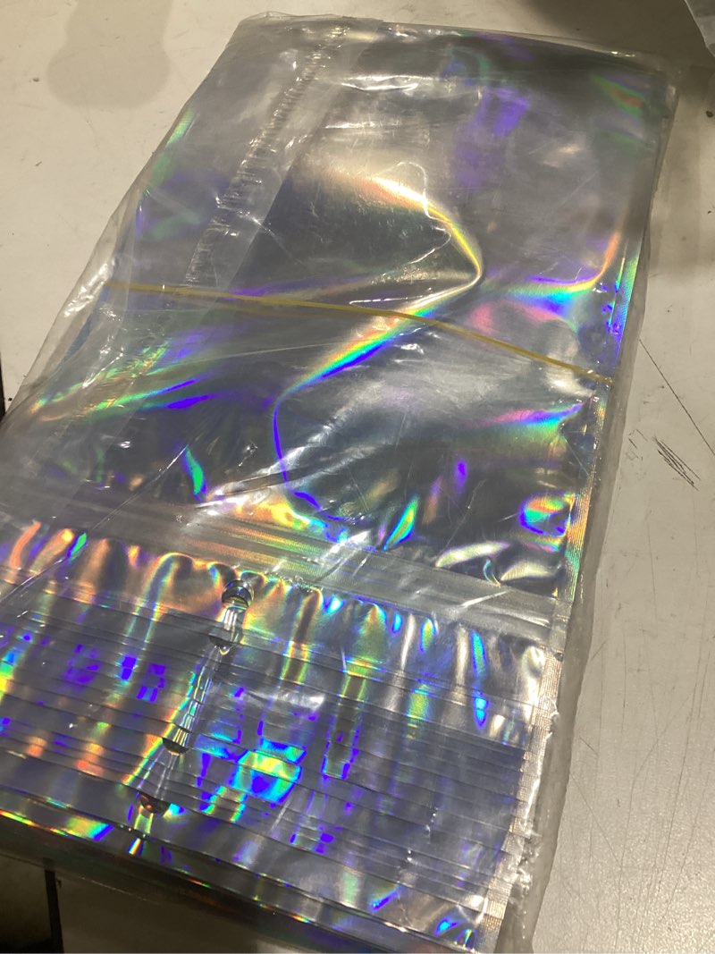 Condition photo showing Good Condition for 50 pcs mylar bags 6x9in, resealable holographic bags, clear smell proof bag for gift, party favor, jewelry, candy, sealable freshie bag for packaging, goodie, treat, cellophane, dispensary bag 50pcs-6x9 inch