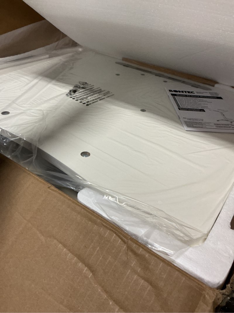 Condition photo showing New/Like New for BONTEC Mobile Standing Desk White, 23.6" x 20.5" 90° Tilting Desktop, Foot Pedal Height Adjustable, Foldable Portable Workstation with Pegboard Storage Shelf, Rolling Base with Hooks and Smooth Wheels