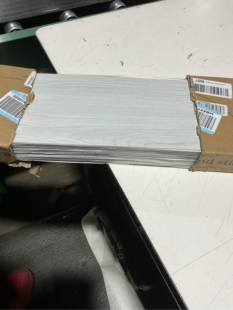 Condition photo showing Good Condition for Art3d Peel and Stick Floor Tile Vinyl Wood Plank 36-Pack 54 Sq.Ft, White-ash, Rigid Surface Hard Core Easy DIY Self-Adhesive Flooring 36 x 6 x 0.1 inches White-ash 36
