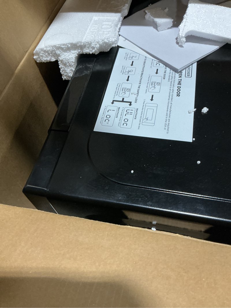 Condition photo showing As Is for BLACK+DECKER EM720CB7 Digital Microwave Oven with Turntable Push-Button Door, Child Safety Lock, 700W, Stainless Steel, 0.7 Cu.ft 0.7 cu. ft.