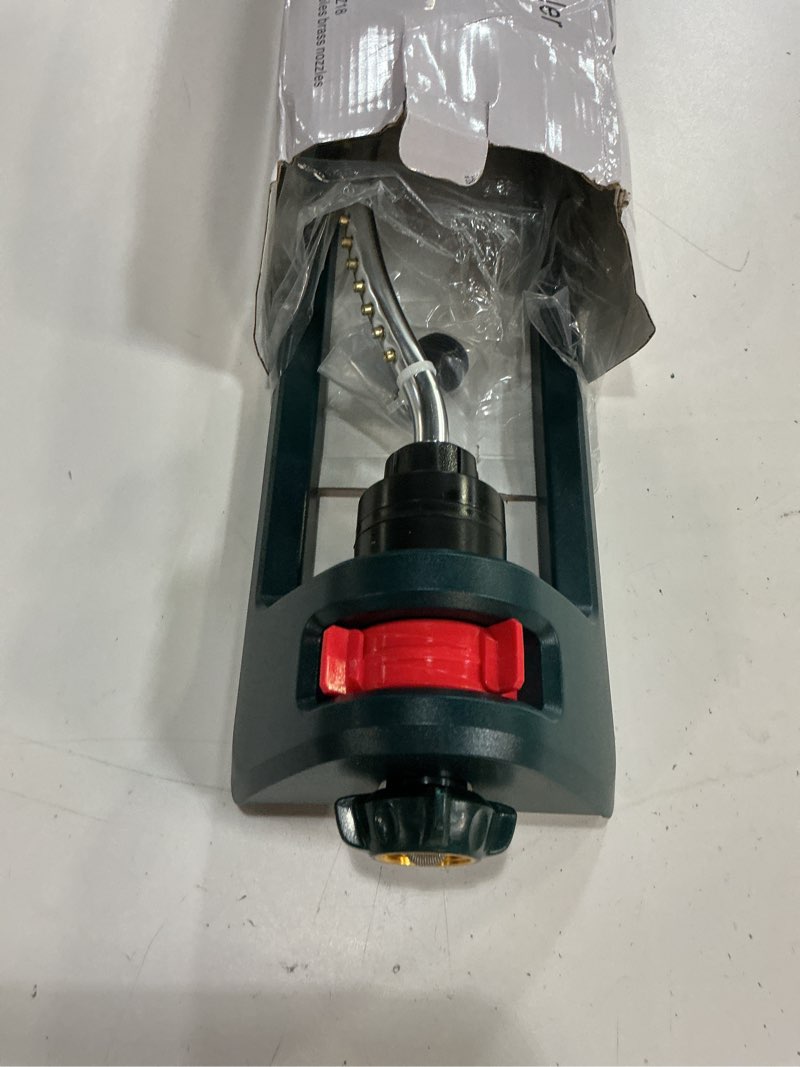 Condition photo showing New/Like New for lawn sprinkler, 18 brass nozzles garden water oscillating sprinkler for yard covers up to 3,600 sq.ft, heavy weight base, built-in spray jet cleaning needle