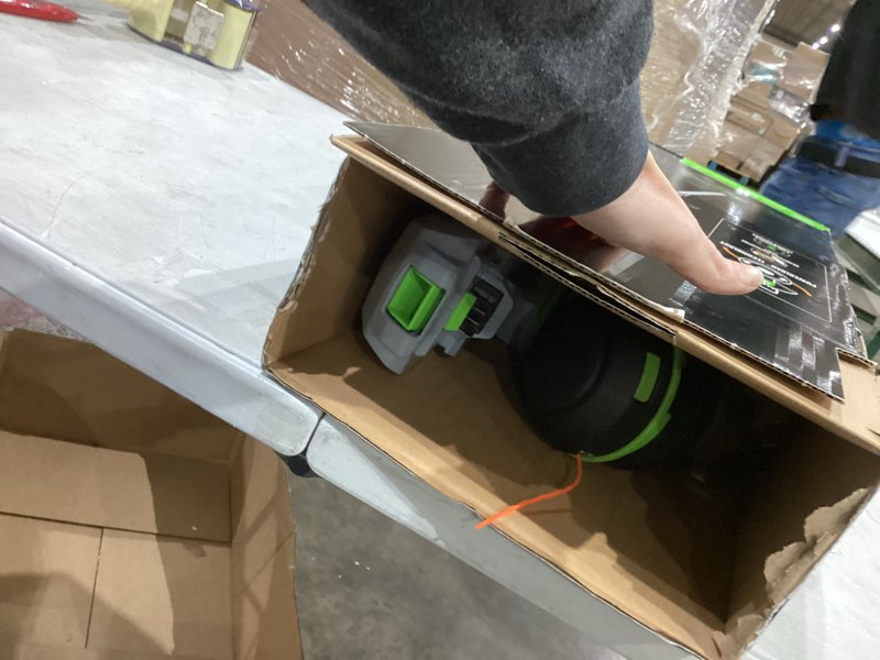 Condition photo showing As Is for ego st1511t 15-inch 56-volt lithium-ion cordless string trimmer kit alu foldable shaft battery and charger included, 15in powerload/telescopic/gauge(2.5ah), black