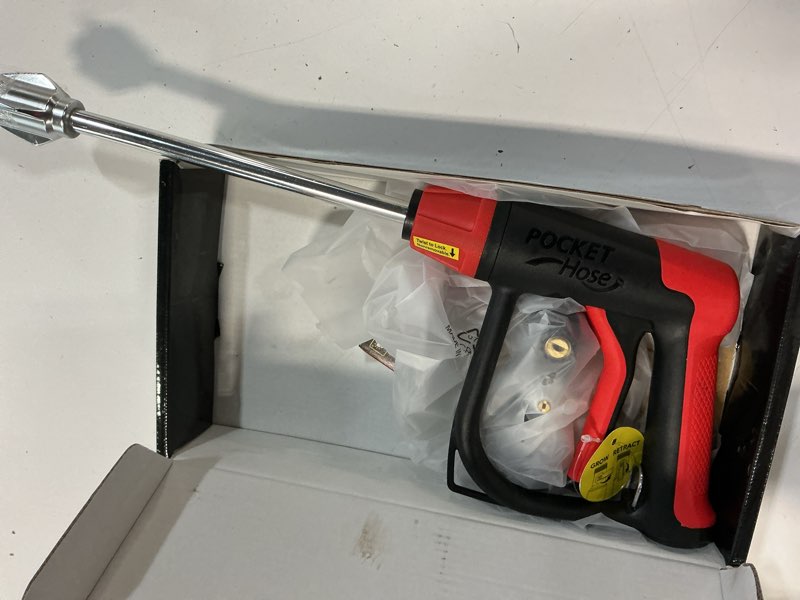 Condition photo showing As Is for pocket hose arrow, as seen on tv, customizable spray nozzle from powerful jet stream cleaning to gentle garden watering, flow force tech, 4 precision tips, rust-resistant, non-slip grip, car wash