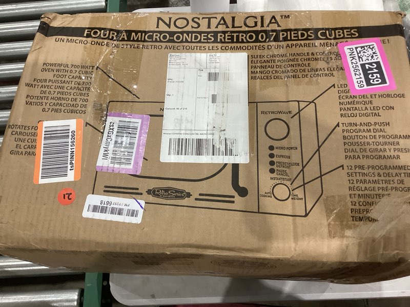 Condition photo showing Good Condition for Nostalgia Retro Compact Countertop Microwave Oven - 0.7 Cu. Ft. - 700-Watts with LED Digital Display - Child Lock - Easy Clean Interior - Red Retro Classic 0.7 Cu. Ft. Red