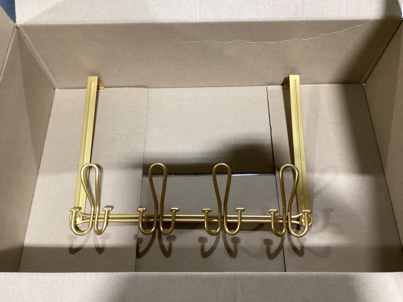 Condition photo showing Good Condition for double prong over the door hook rack, with 4 triple hooks to hang your coats, hats, towels, purses and more in your bathroom, bedrrom or walk-in closets - gold