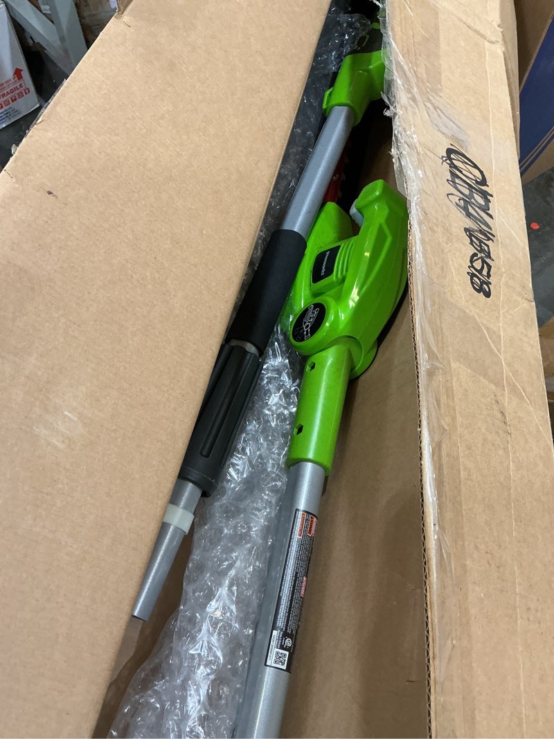 Condition photo showing As Is for greenworks 40v 20" cordless pole hedge trimmer, 2.0ah battery and charger included 20" pole hedge trimmer