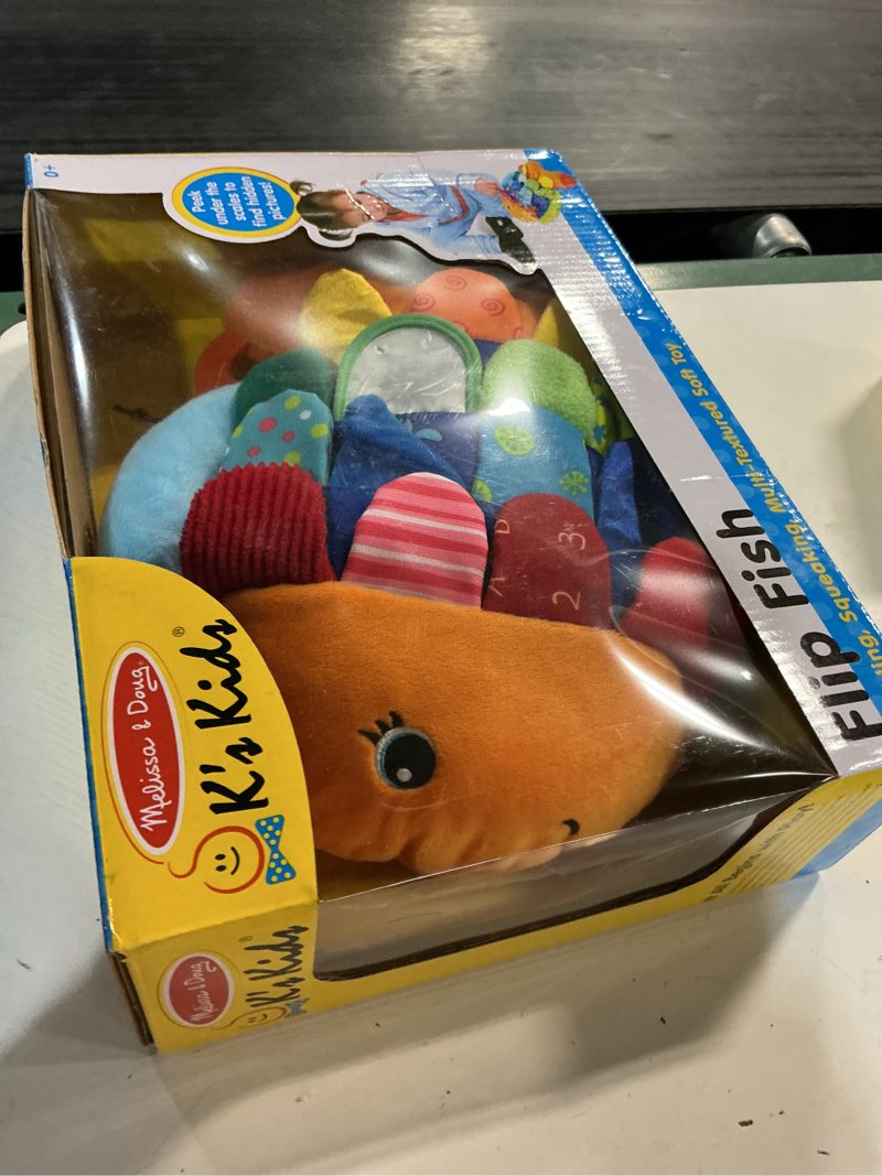 Condition photo showing New/Like New for melissa & doug flip fish soft baby toy
