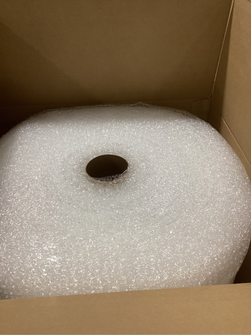Condition photo showing As Is for Amazon Basics Bubble Cushioning Wrap Packing Material for Fragile Items, Perforated, 12 inch x 175 ft Long Roll, Small 3/16", Clear Clear 12 inch x 175 ft