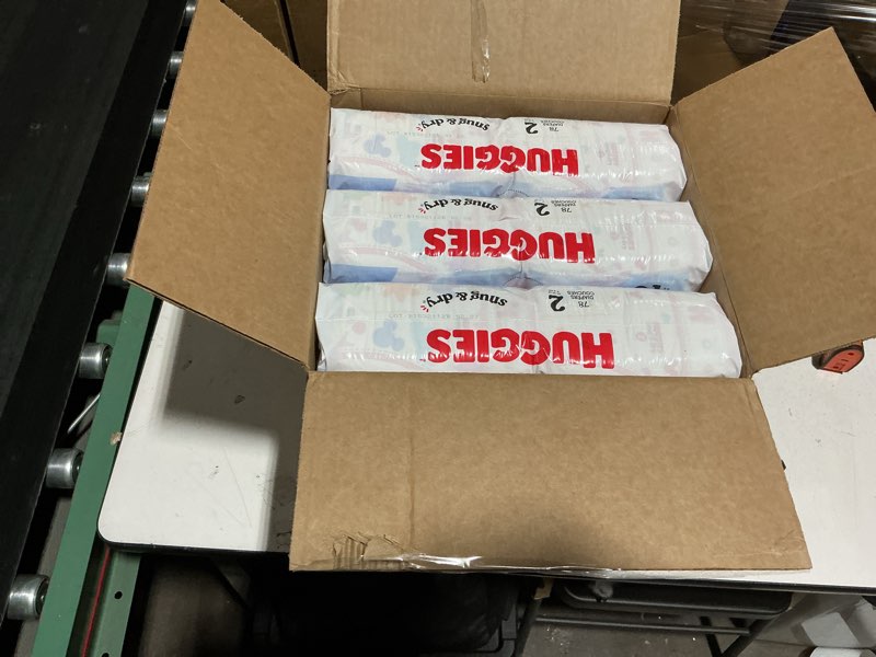 Condition photo showing New/Like New for huggies snug & dry disposable diapers - size 2 - 234ct